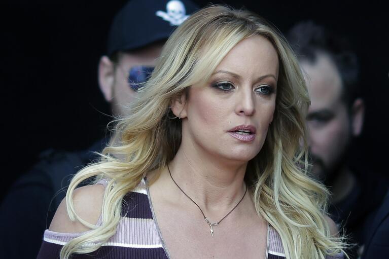 FILE - Adult film actress Stormy Daniels arrives at the adult entertainment fair "Venus" in Berlin, Oct. 11, 2018. (AP Photo/Markus Schreiber, File)